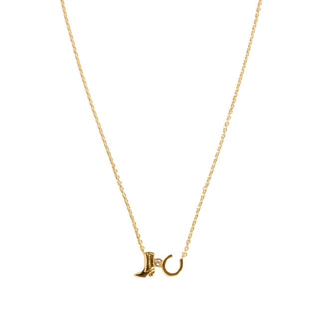 Gold necklace with a crescent moon and star pendant.