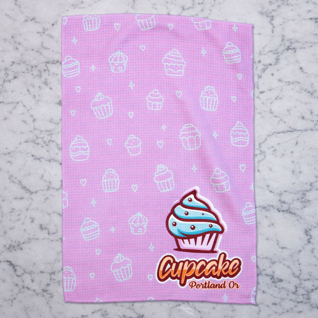 Pink towel with cupcake pattern and 