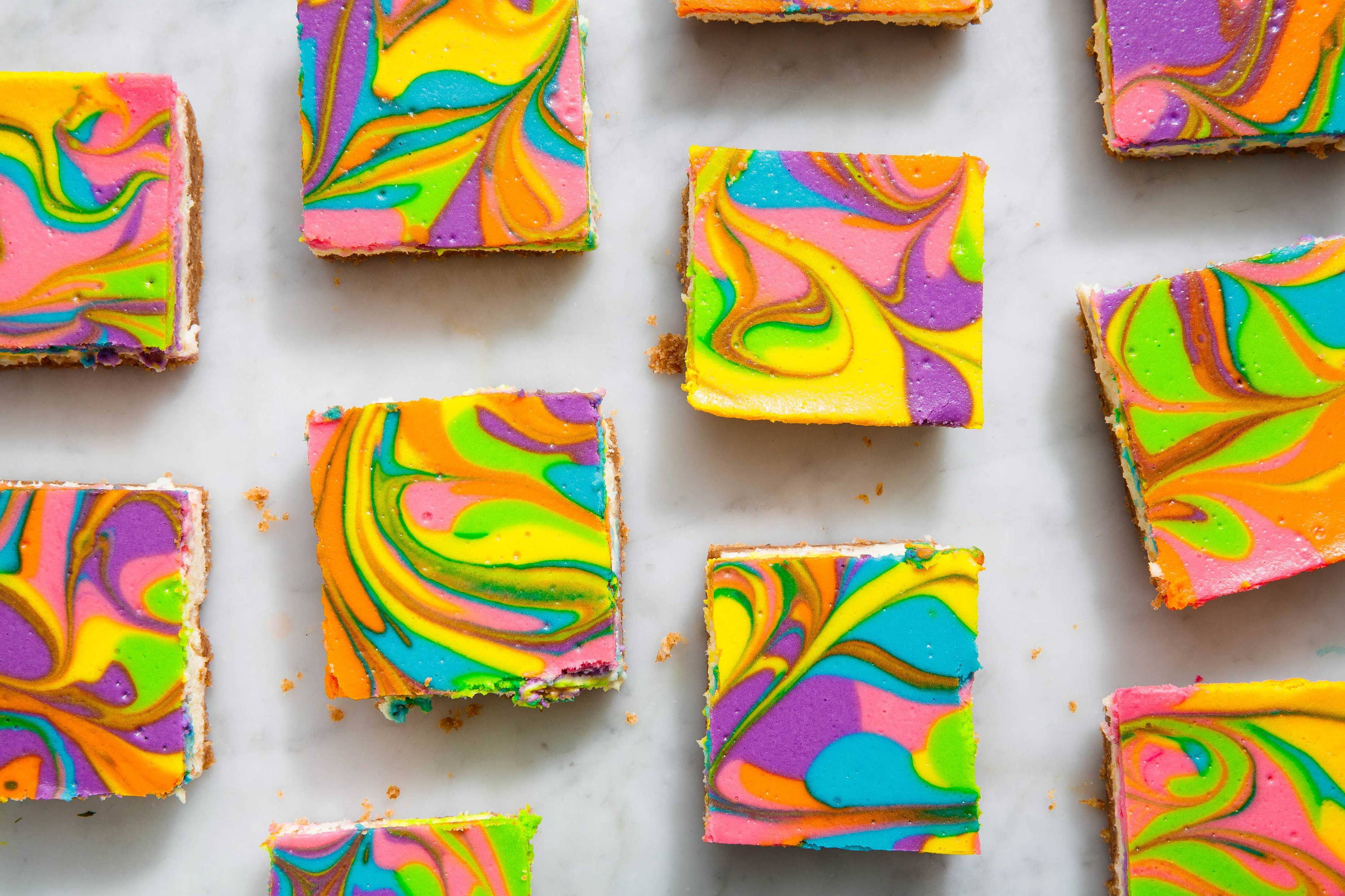 Image of colourful rainbow cheesecake bars.