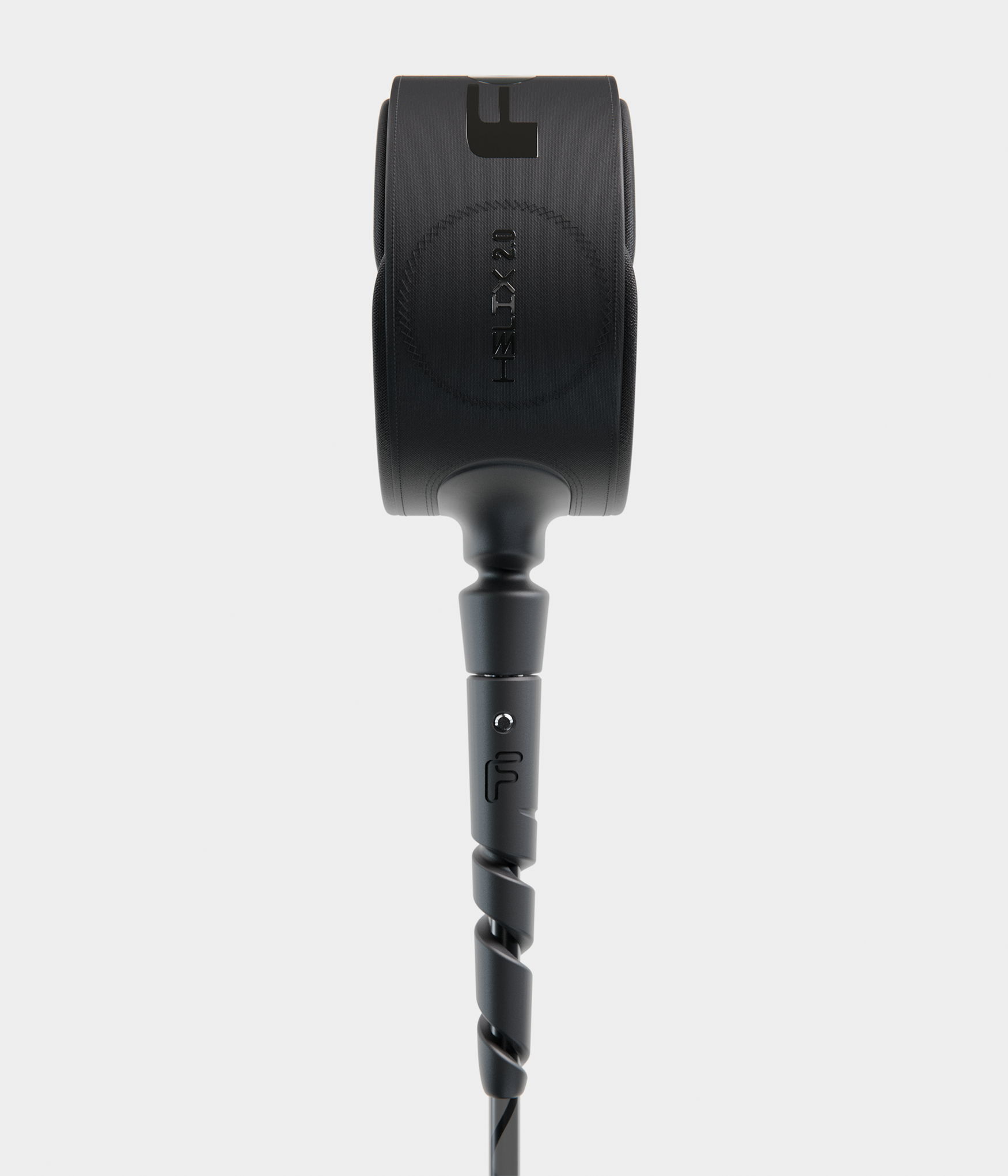 Black headphone with a twisted cable against a light gray background.