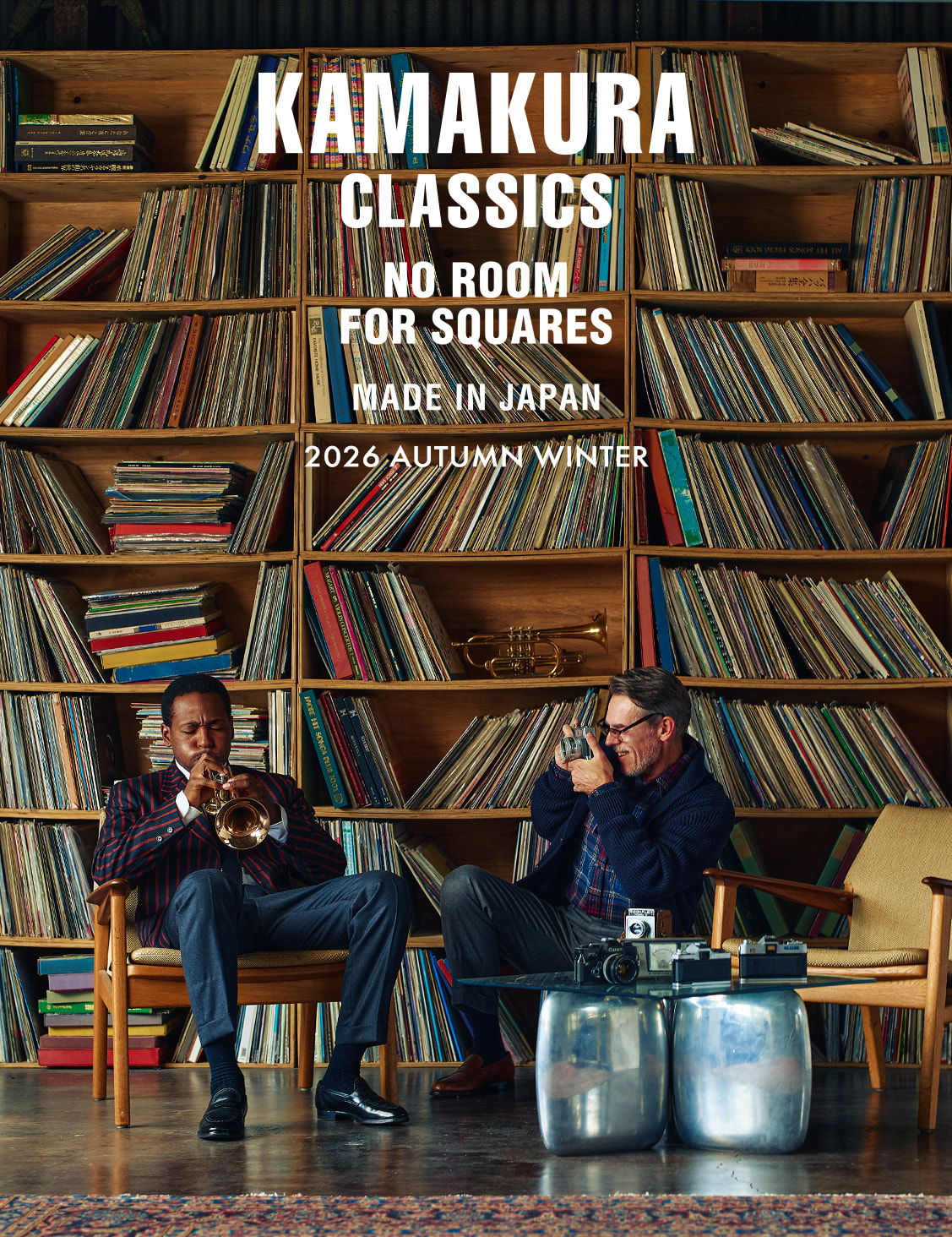 Two men sitting among shelves of records, promoting Kamakura Classics.