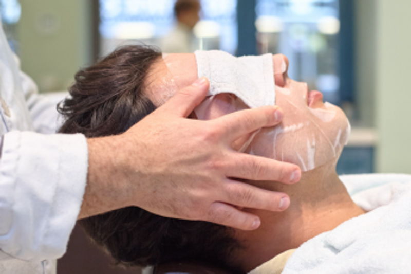 Barber giving a hot towel treatment