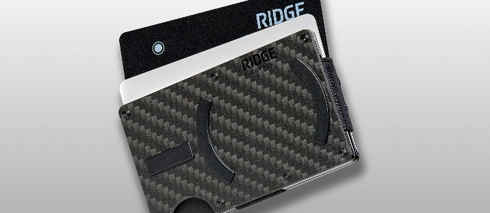 A sleek carbon fiber wallet with Ridge branding.
