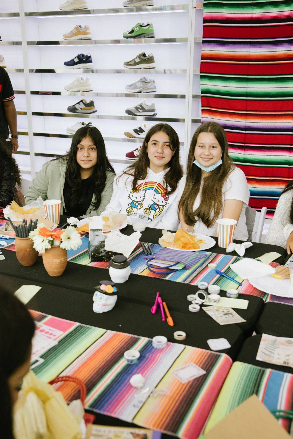 hispanic heritage month x new balance 3 girls look up from their crafts