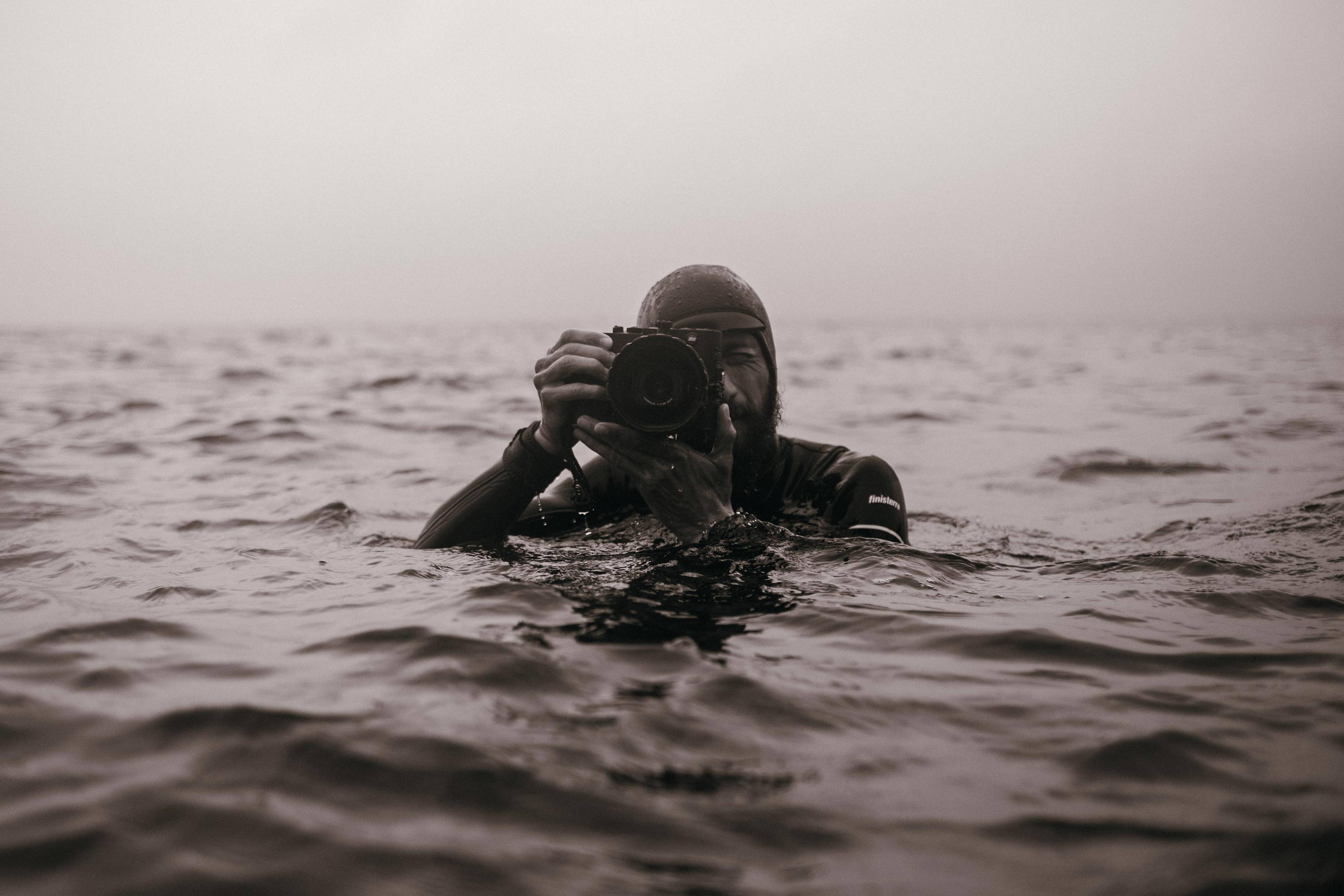 Black and white image of Nick Pumphrey shooting in the water