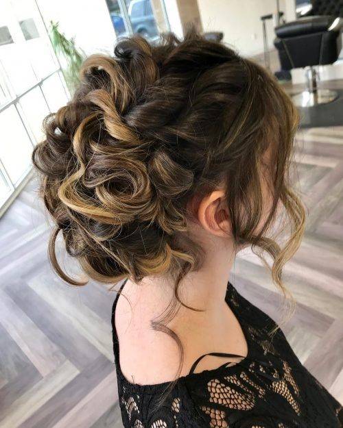 Girl with brown hair updo with loose curls