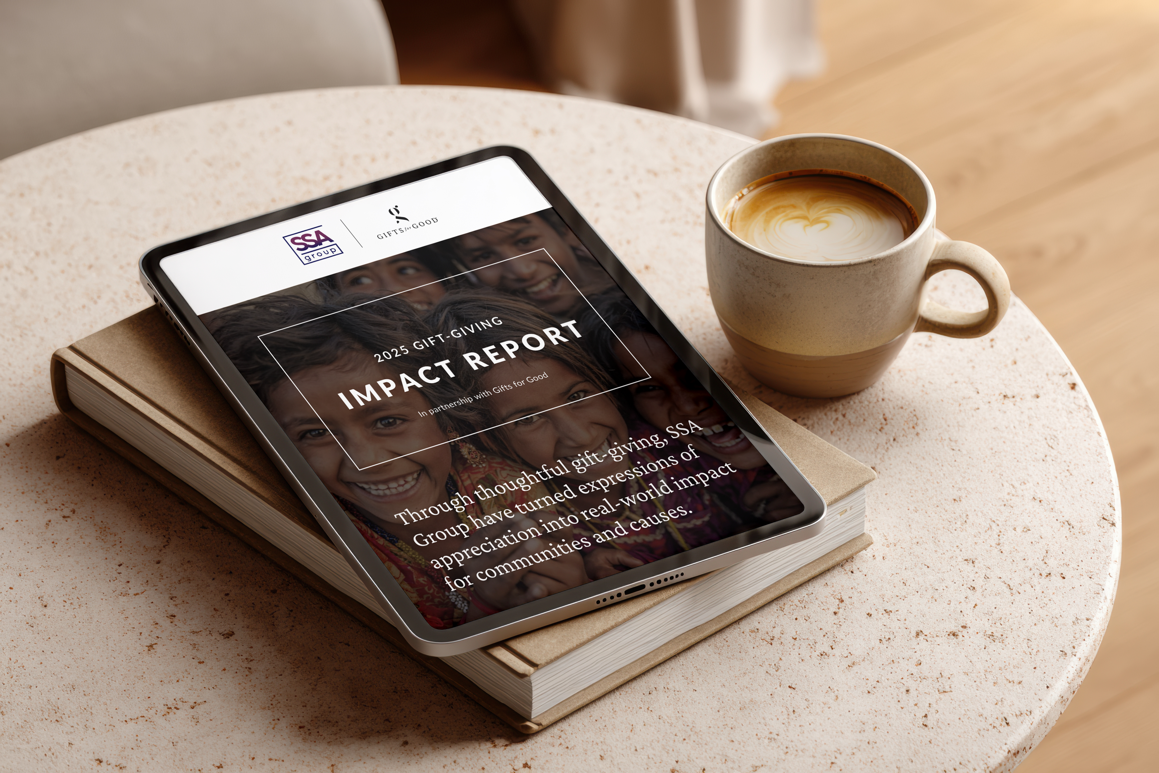 Tablet displaying an impact report on a table with a coffee cup.