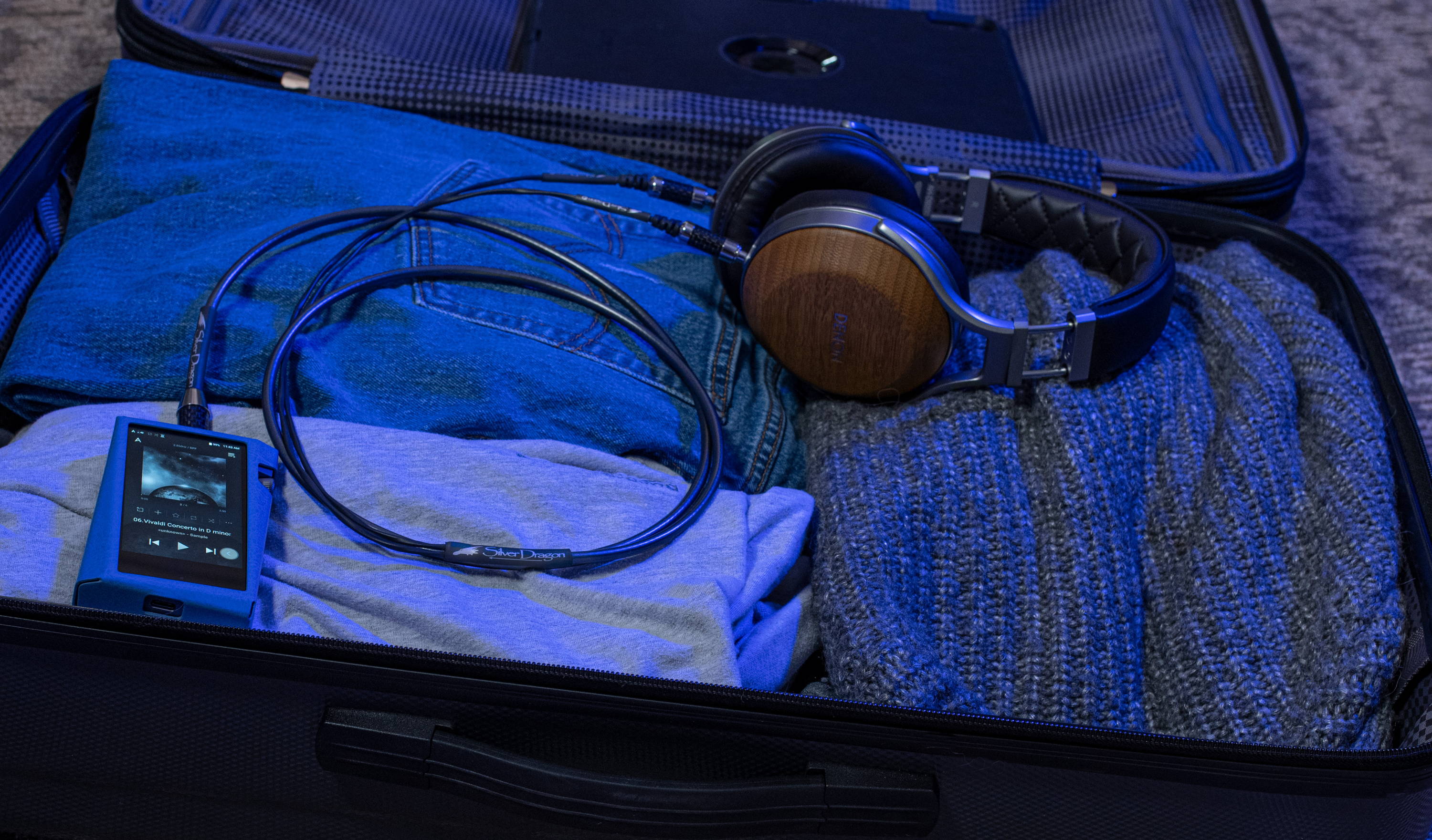 open suitcase with headphone and DAP