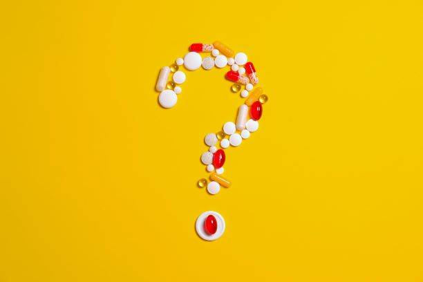 Medication Pills In The Shape Of A Question Mark