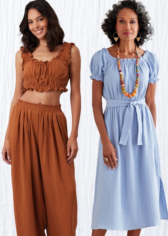 Two women modeling stylish outfits, one in brown and the other in blue.