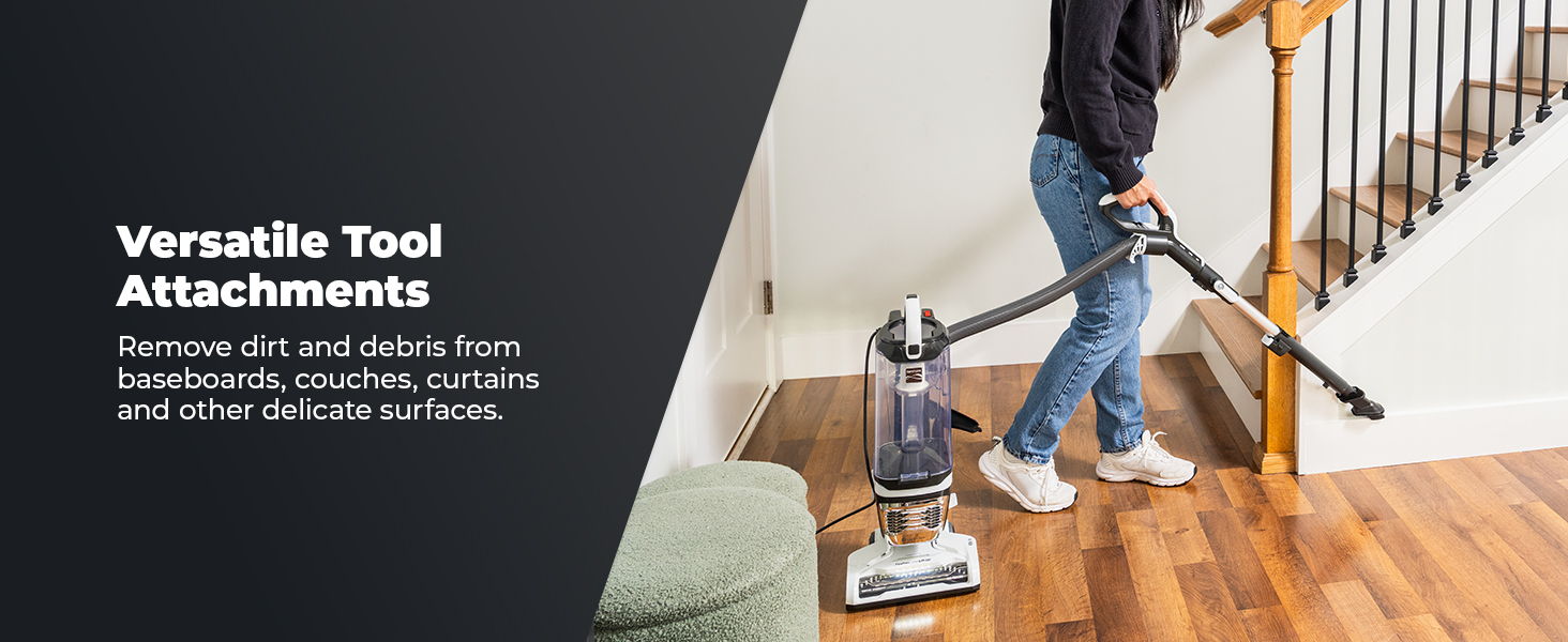 Person vacuuming stairs with a versatile tool attachment for cleaning.