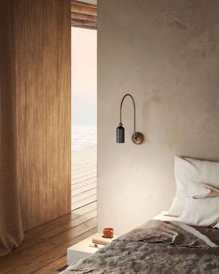 Dainty Brass Italian Wall Light | Grafene near a bed in a modern interior