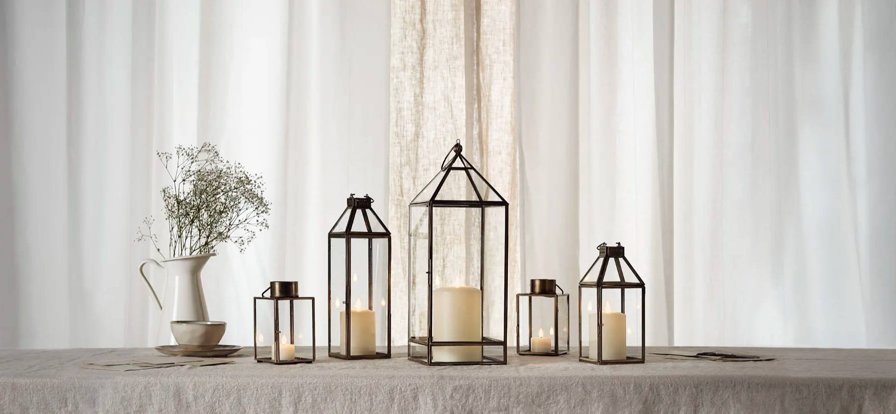 a collection of wedding lanterns with LED candles inside