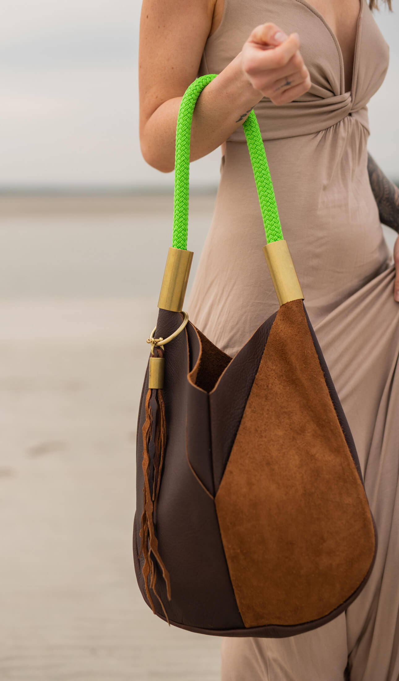closeup on brown leather tote with neon green dock line