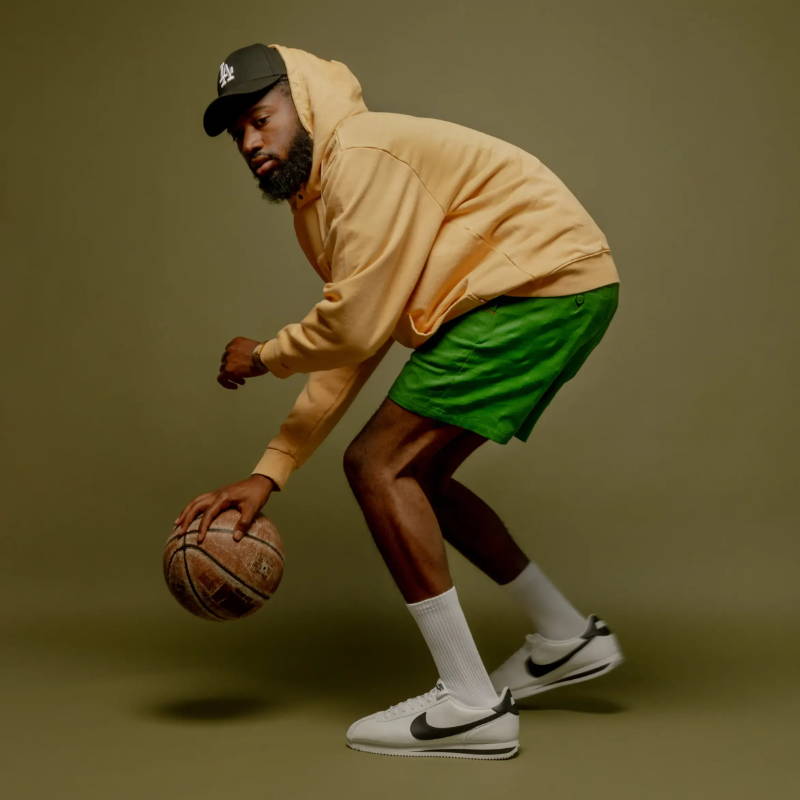 male model dribbling basketball in honor the gift apparel