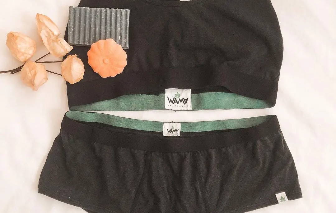 Flat lay image of a WAMA racerback bralette and hipster panties