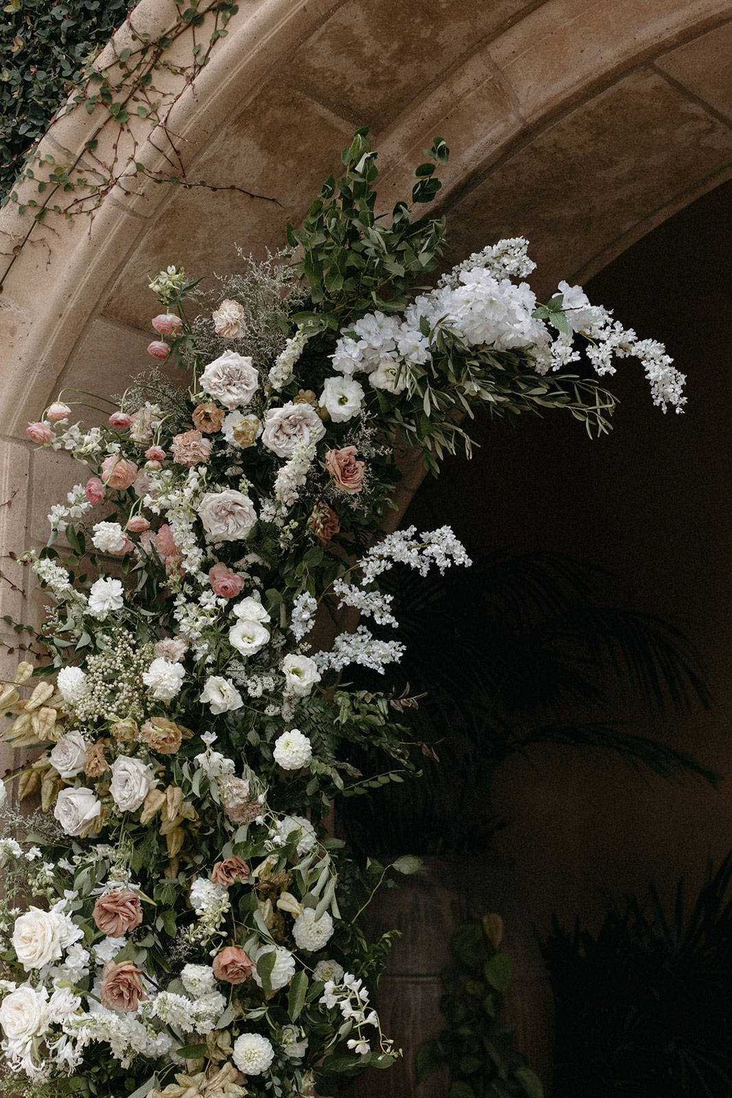 Floral arrangement under archway
