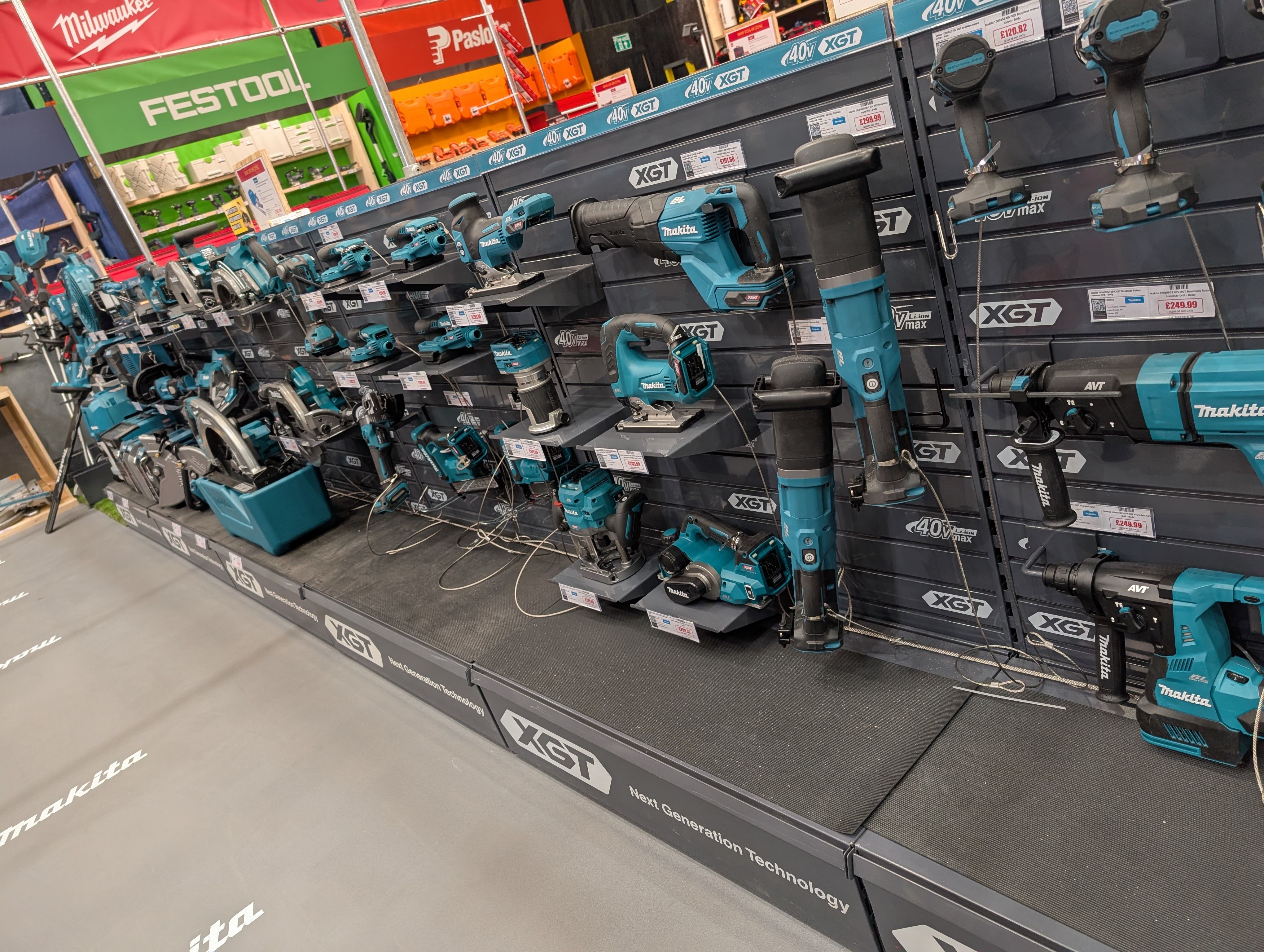 Display of various power tools on shelves in a store.