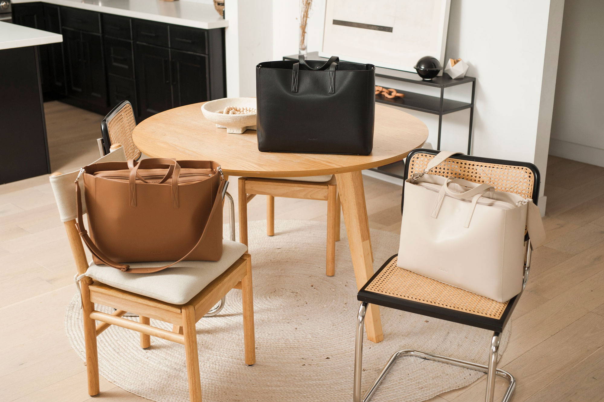 CALPAK Haven Laptop Tote in Toffee, Birch and Black.