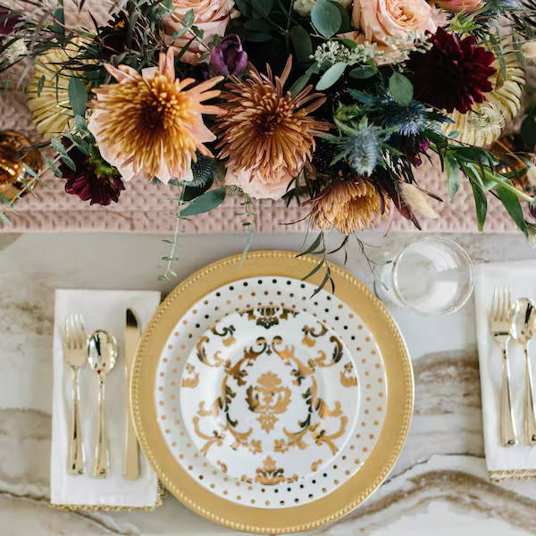 fall flowers and gold plate table setting