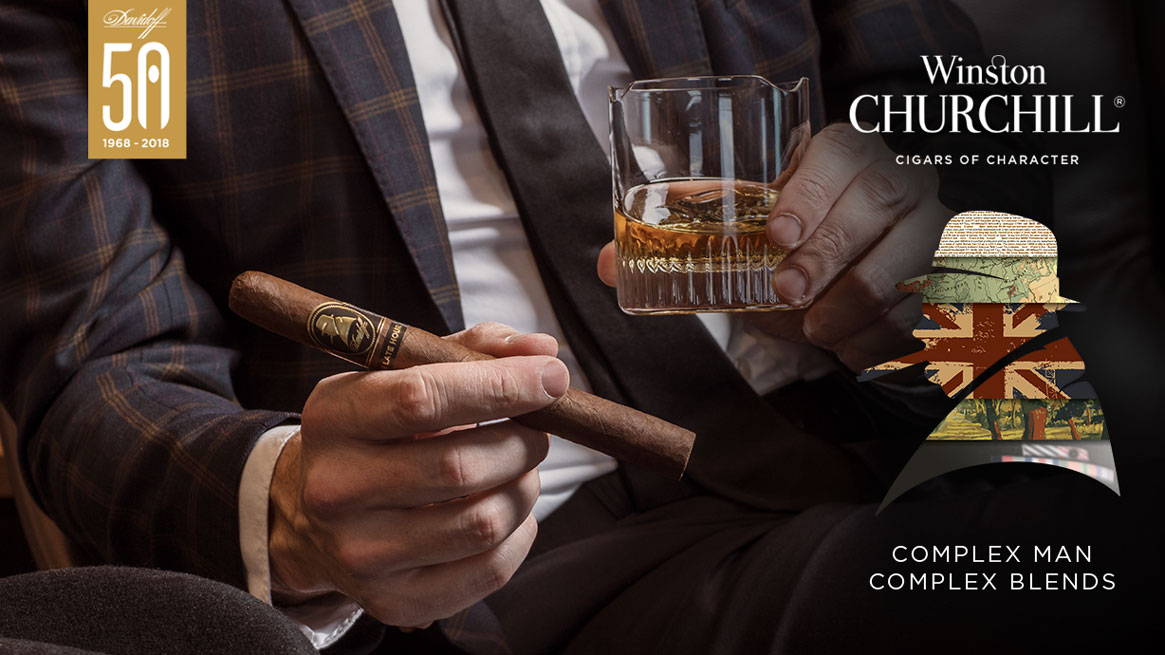 Hands holding a Davidoff Winston Churchill «The Late Hour Series» Churchill Cigar and a glass of Whisky