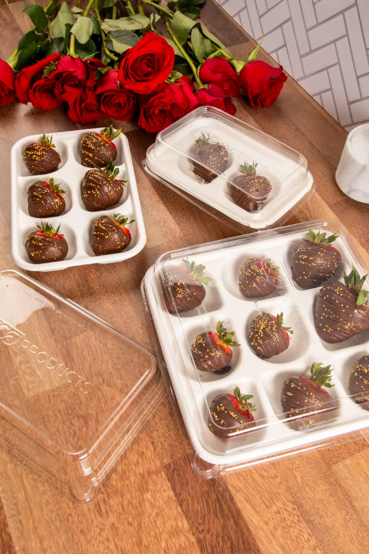 Six compartment tray displaying chocolate covered strawberries