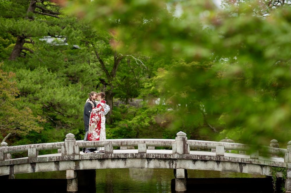 engaged couple on bridge in kyoto, japan