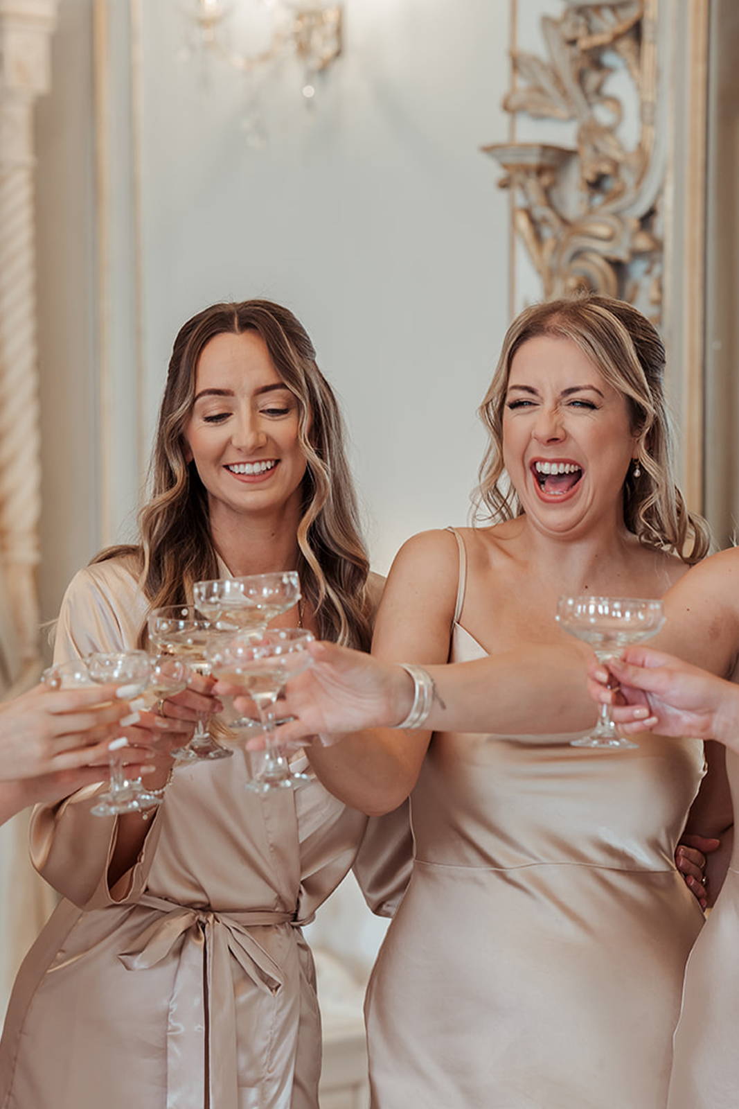 Bride, raising a toast with her bridesmaids