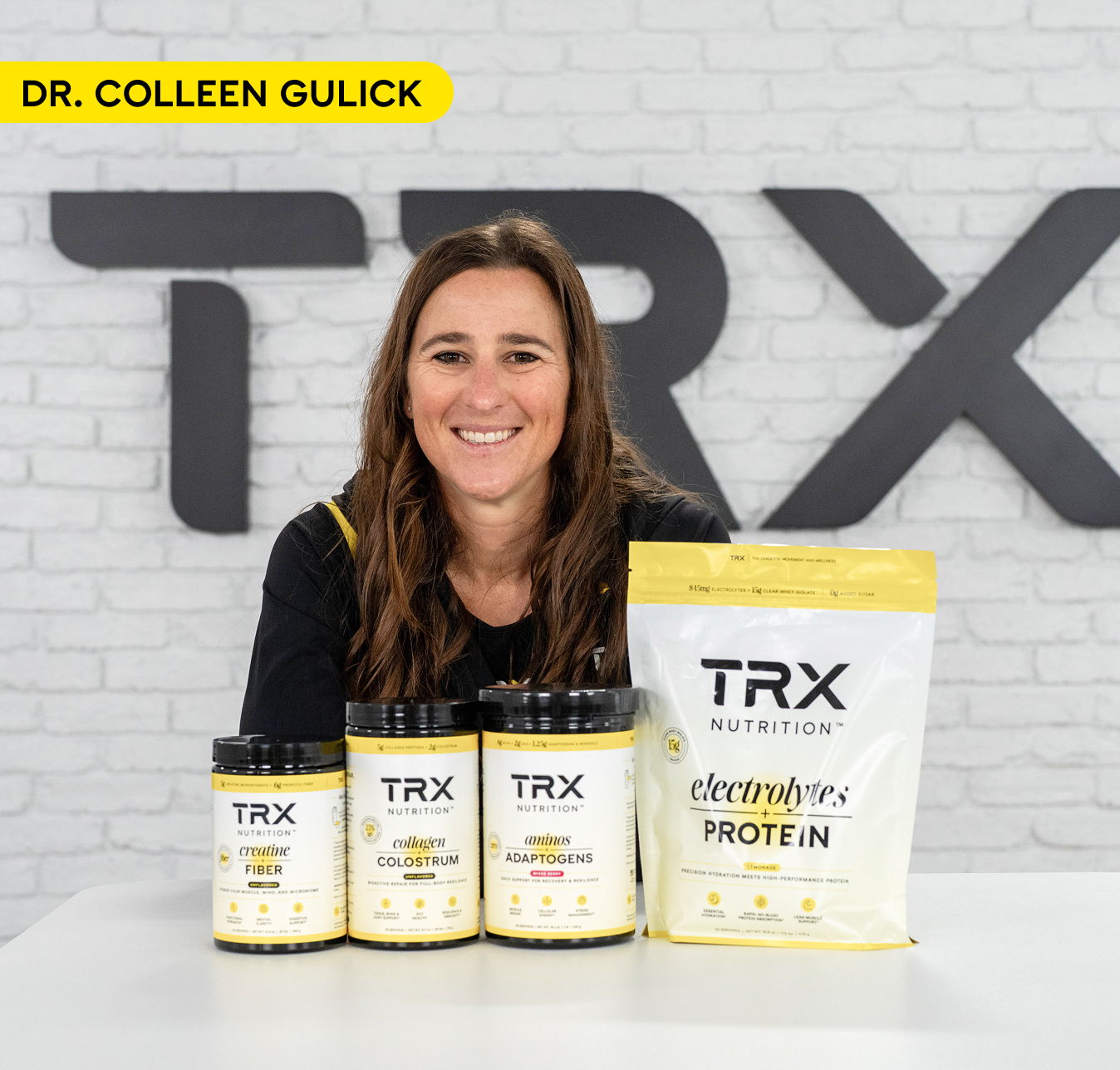 Dr. Colleen Gulick with TRX products on a table.