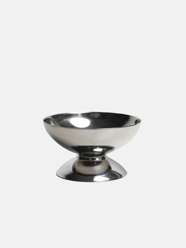A shiny silver bowl on a pedestal base.