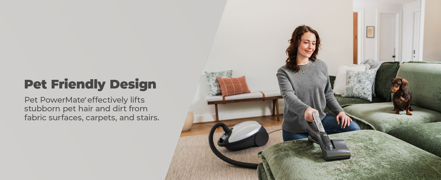 Woman vacuuming a couch with a pet-friendly design.