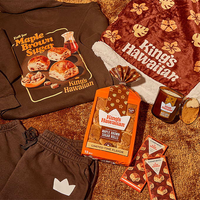 King's Hawaiian Maple Brown Sugar Merch Collection laid out on an amber background: a brown 