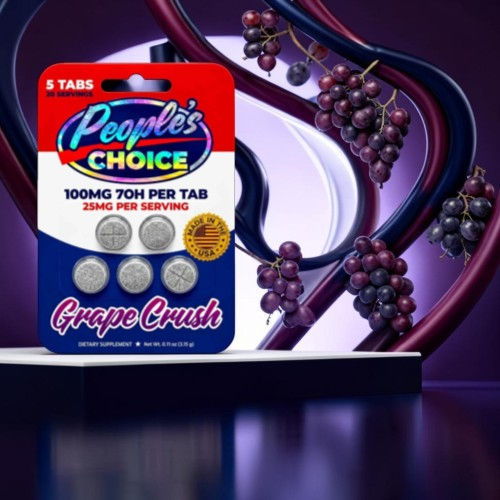 Grape-flavored supplement packaging with decorative grapes in the background.