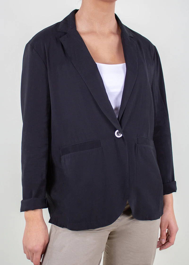 A model wearing a black cropped tailored jacket