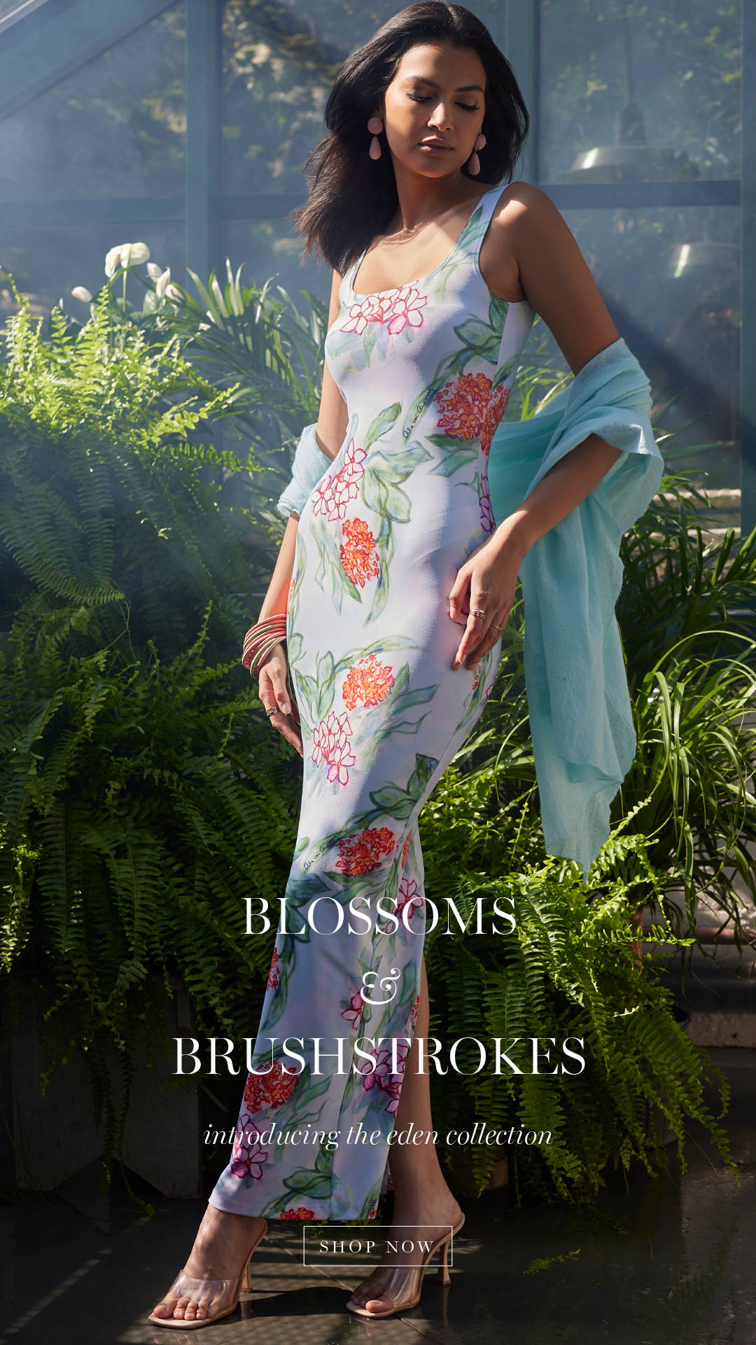 BLOSSOMS & BRUSHSTROKES | Introducing the eden collection | Woman wearing flora long dress with blue scarf in a greenhouse 