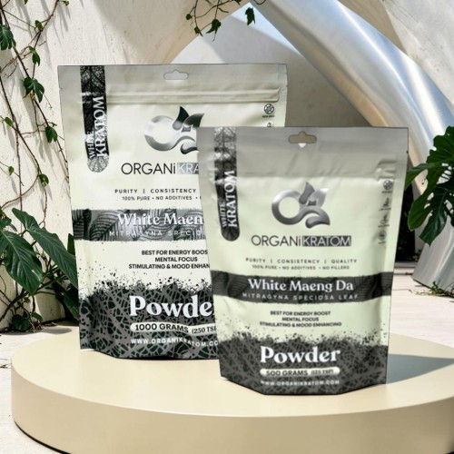 Two bags of organic powder products on a display surface.
