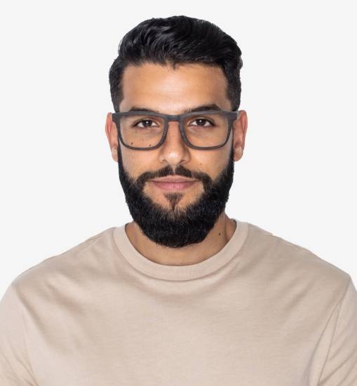 Man with big nose wearing Bold Black, Rectangle Eyeglasses made from Oak Wood with a beige shirt
