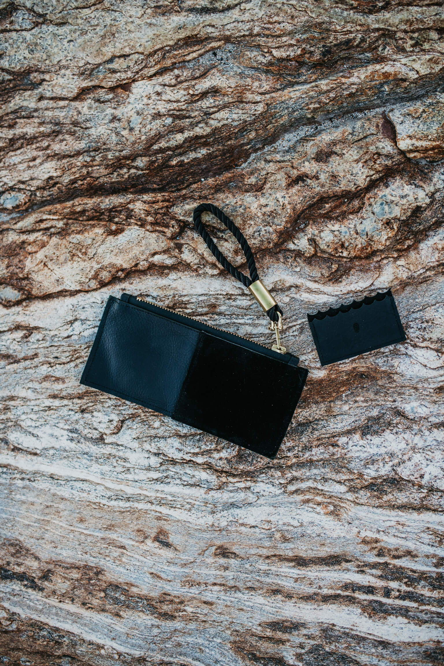 black leather clutch and wallet