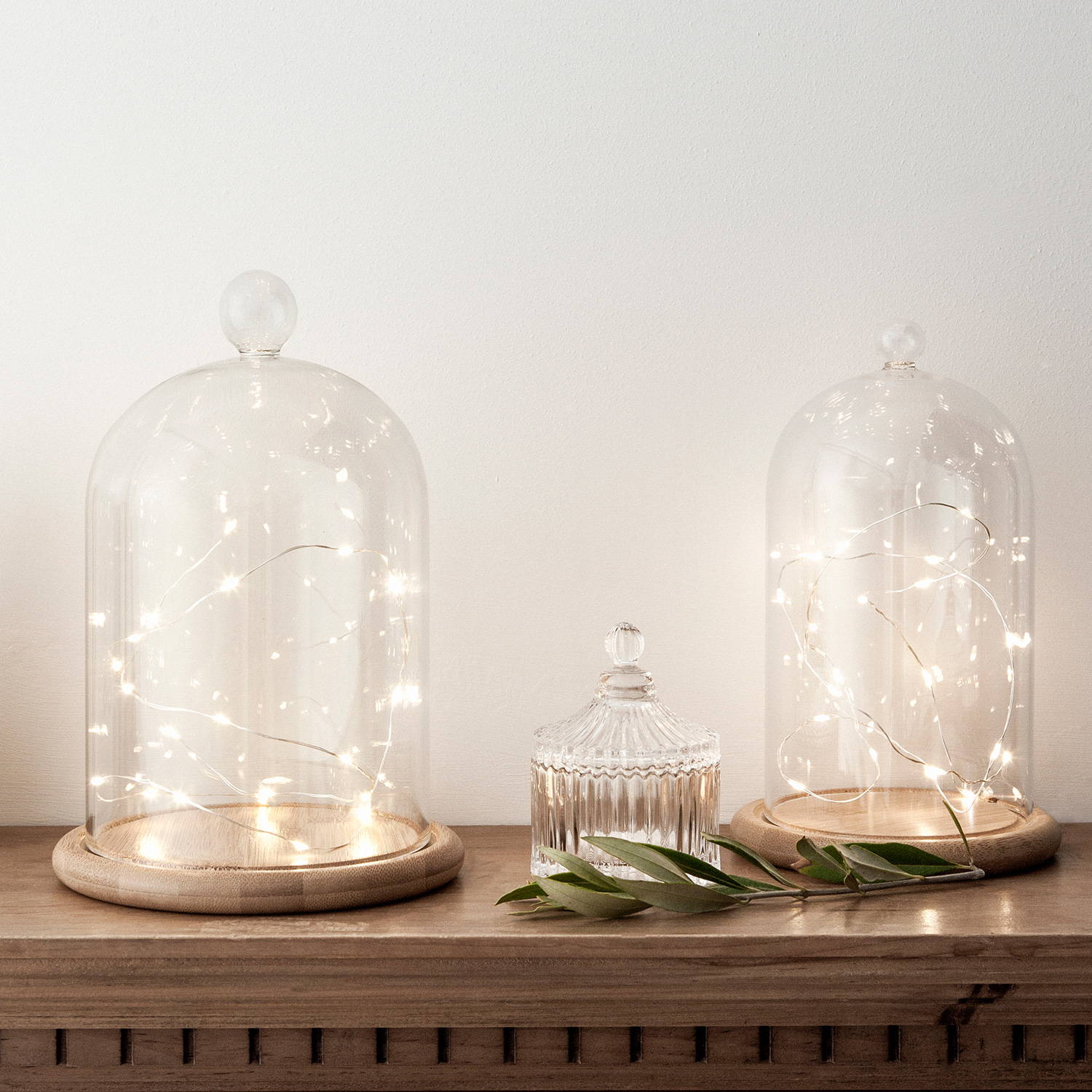 Micro lights styled within glass domes and illuminated