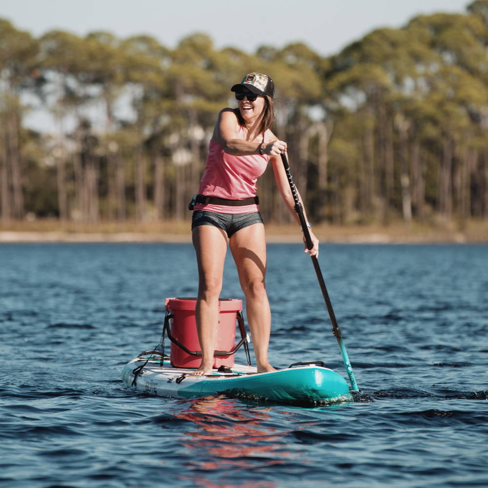 Woman paddling her Flood Aero Native Patchwork
