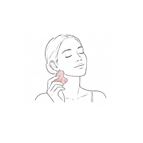 Woman using a pink facial tool on her cheek, eyes closed, serene expression.