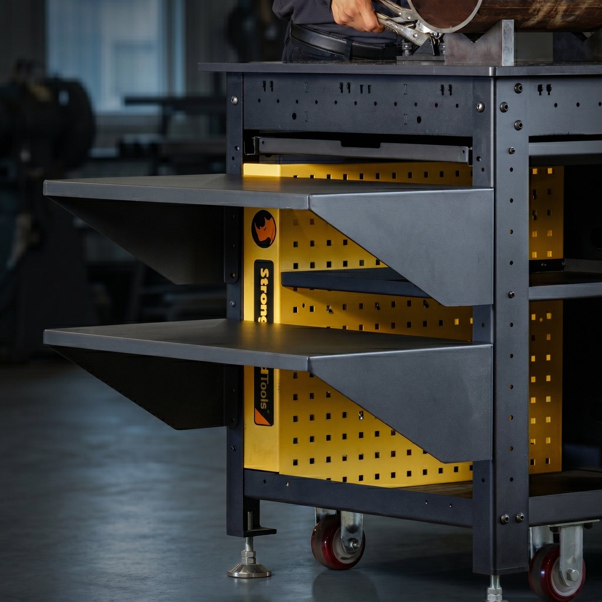 Black storage cart with yellow accents and multiple shelves.