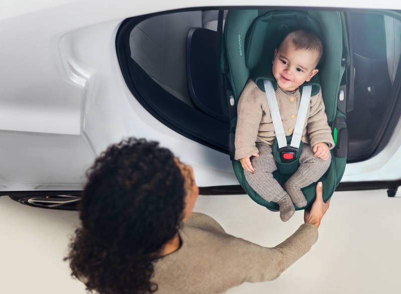Bab y in a maxi-cosi pebble 360 pro car seat in a car