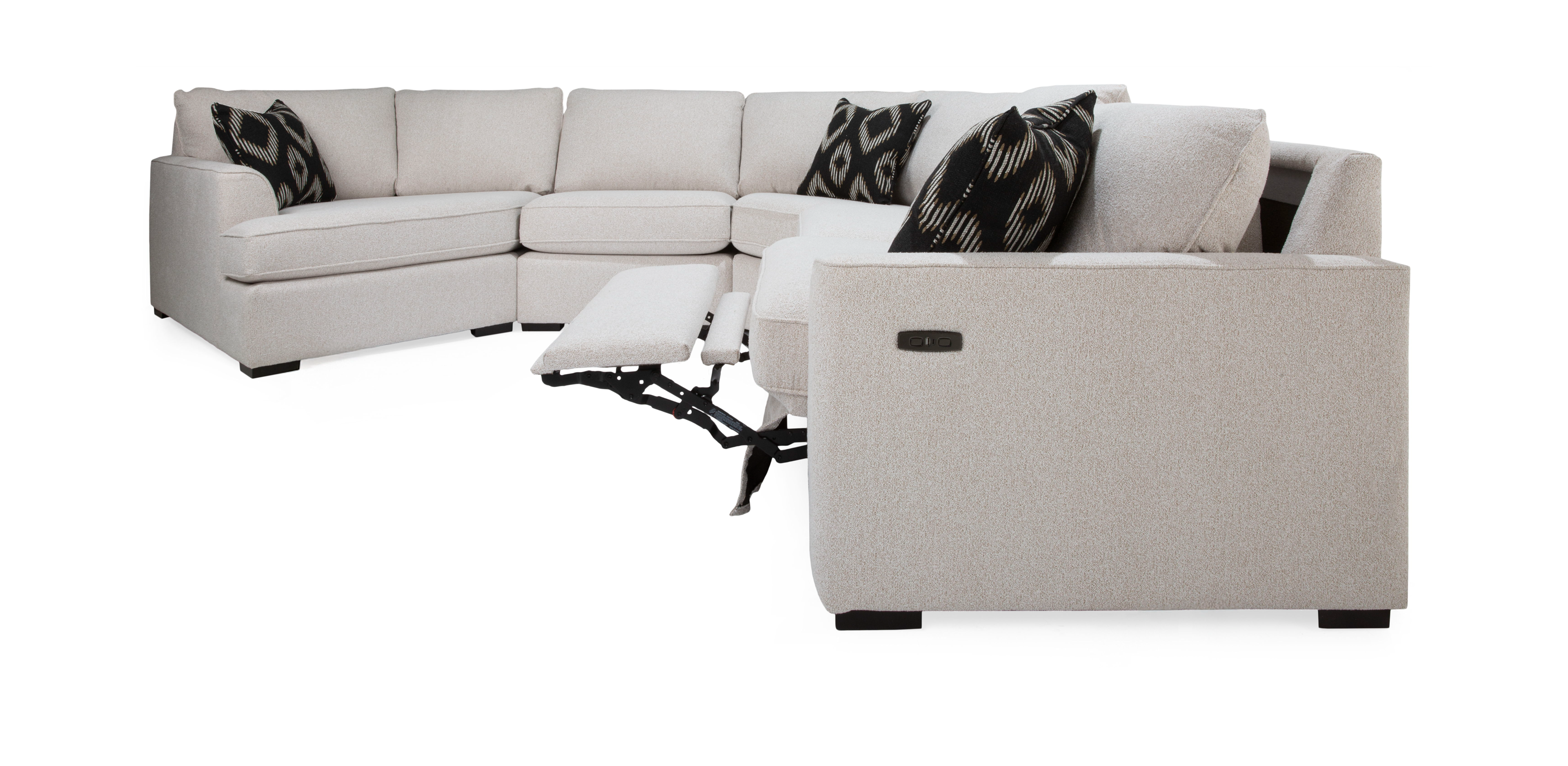 Corner sectional sofa with reclining feature and decorative pillows.