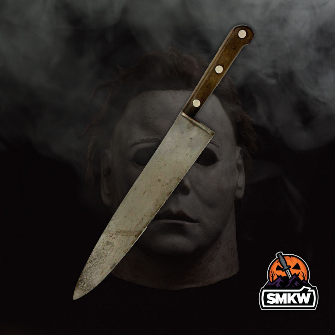 Knife against a smoky background with a masked figure.