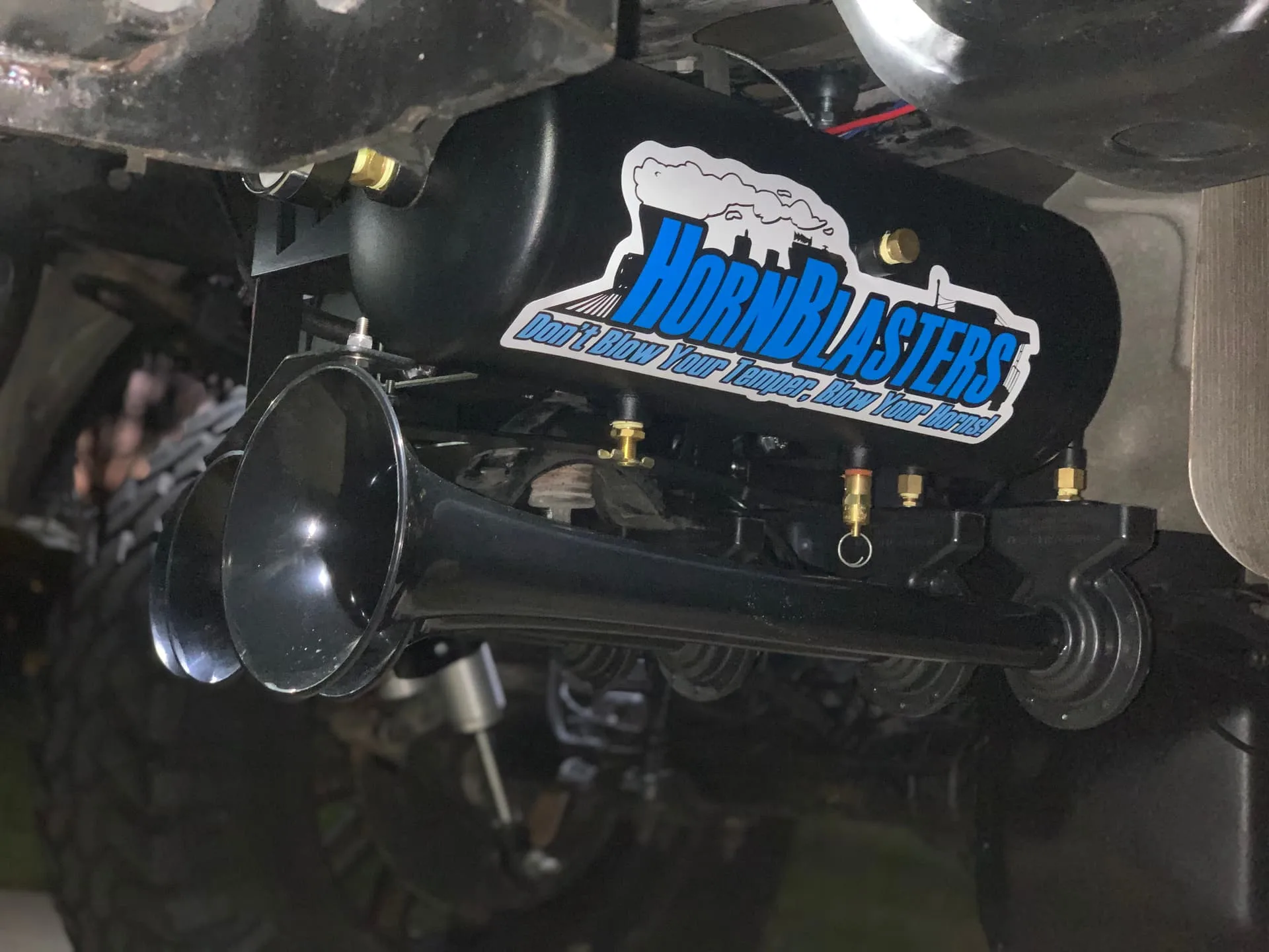 HornBlasters air tank and horn mount close-up under truck