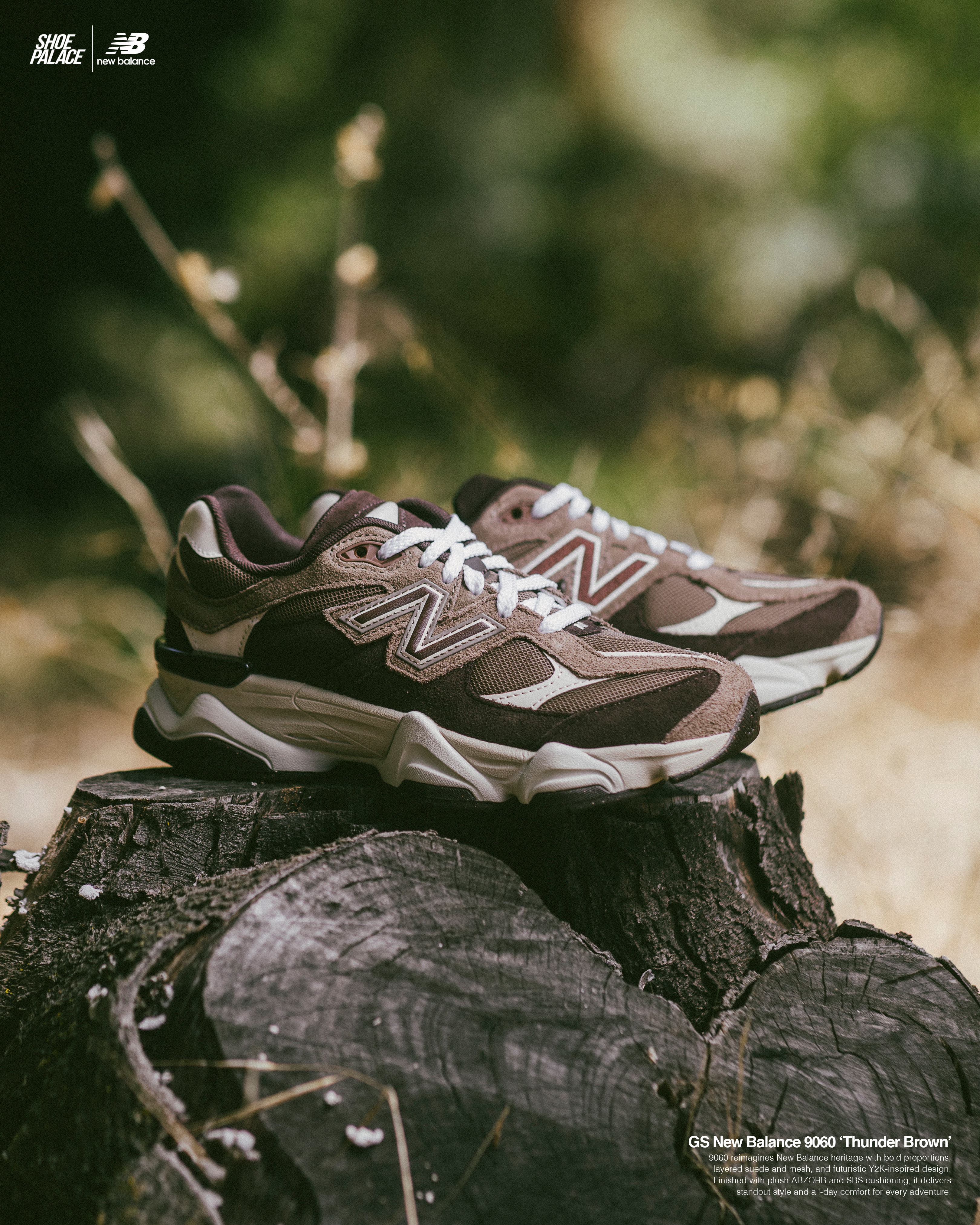 A pair of brown New Balance sneakers on a tree stump.