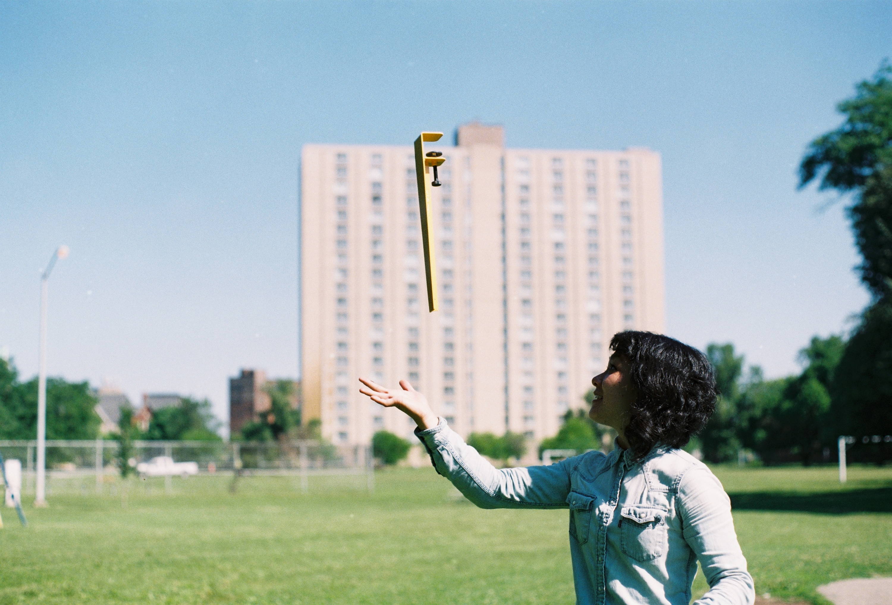 Woman with yellow metal Floyd furniture leg