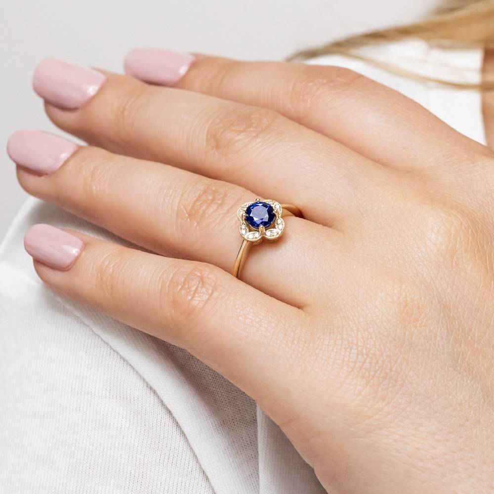 Floral inspired diamond halo engagement ring with 1ct round cut lab created blue sapphire in 14k rose gold setting