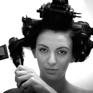 Girl with curlers in 